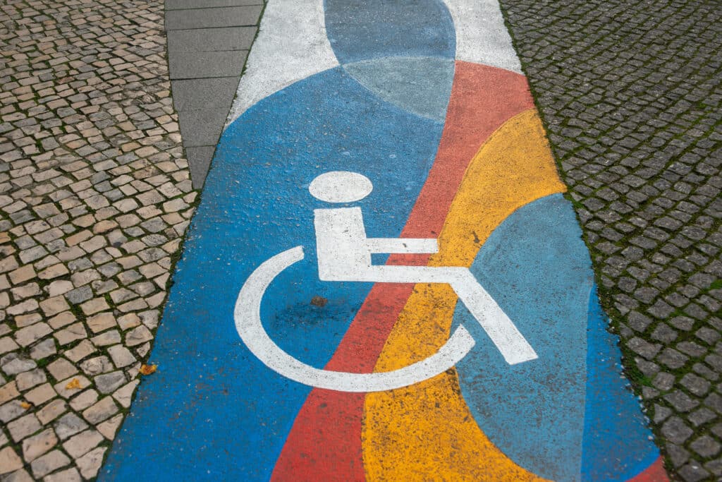 disabled people through a cobblestone street